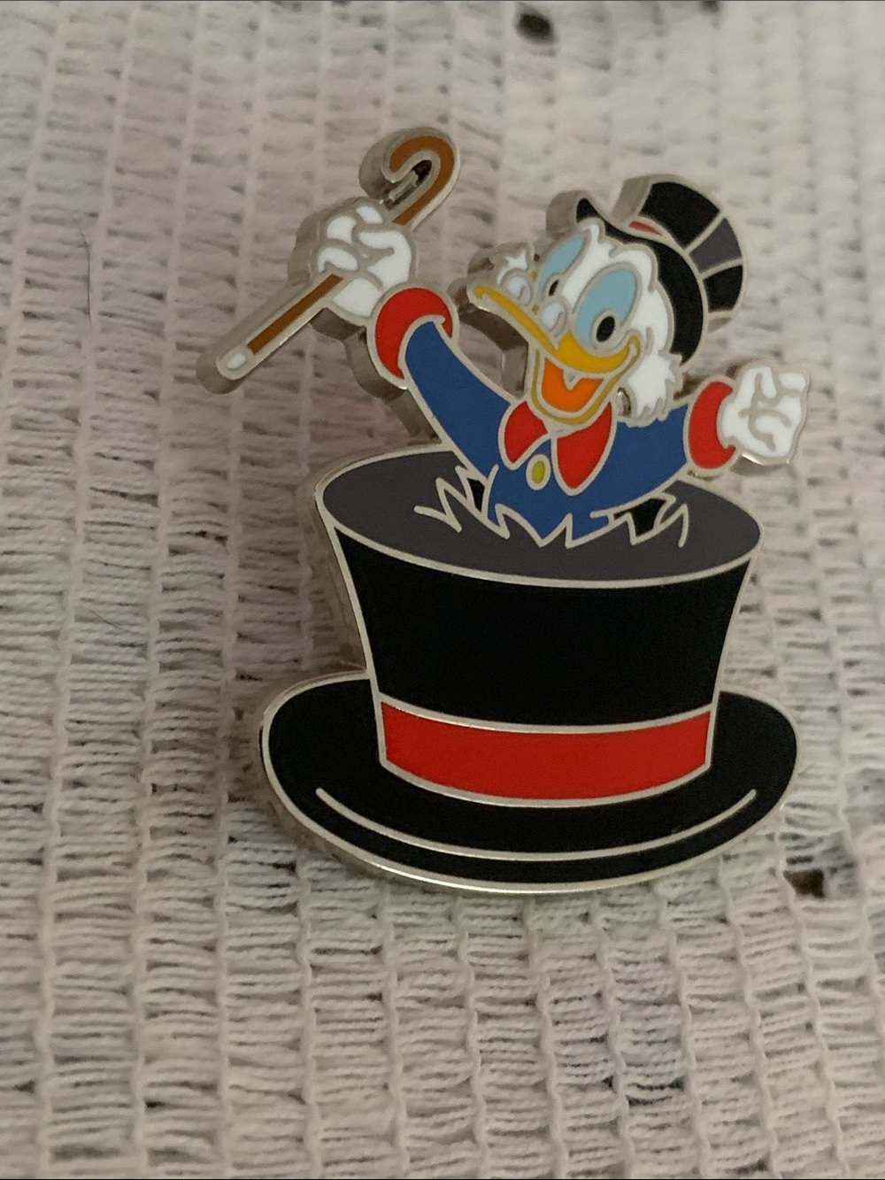 Disney Pin 2024 Features Scrooge McDuck Jumping Out of a Top Hat With a Red Band